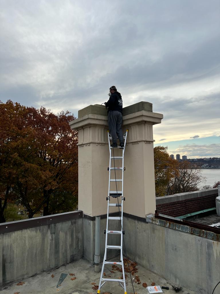 A technician is installing a bird guard.