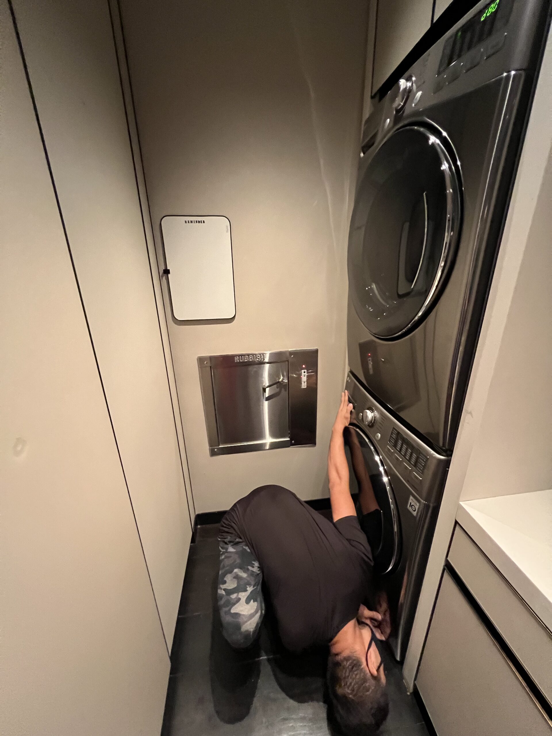 Technician inspecting the dryer vent prior to cleaning.